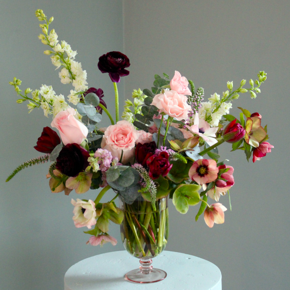Large arrangement with hellebore, roses, tulips